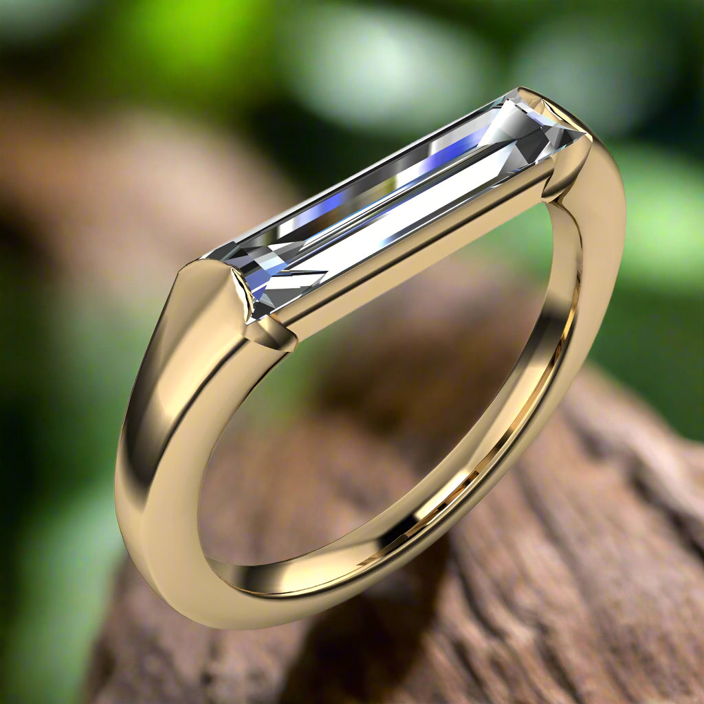 thorn ring - elongated 2 carat baguette ring - angle view with leaves in the background