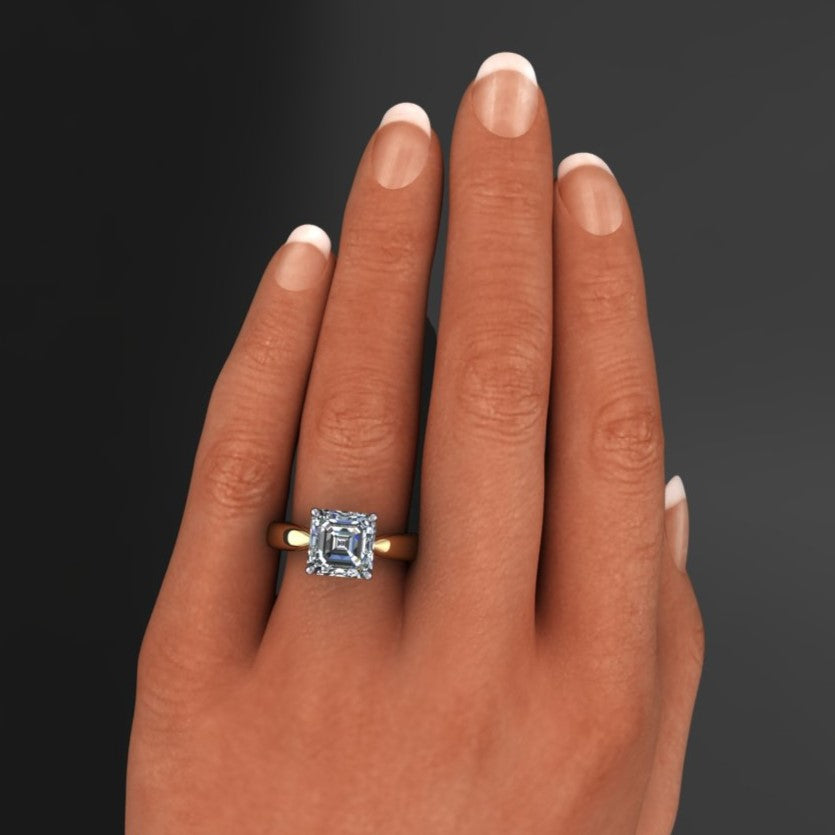 2.7 carat asscher solitaire engagement ring with a wide band that tapers towards the center stone - hand model