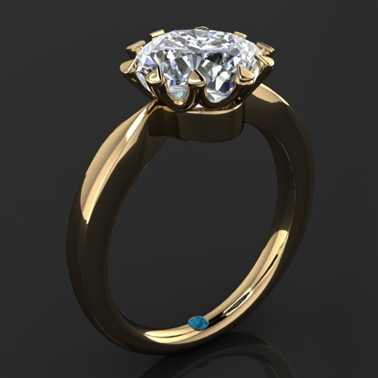 The Lady Danbury ring featuring a 2.5 carat old mine cut cushion moissanite center. A solitaire ring with 10 prongs, angle view