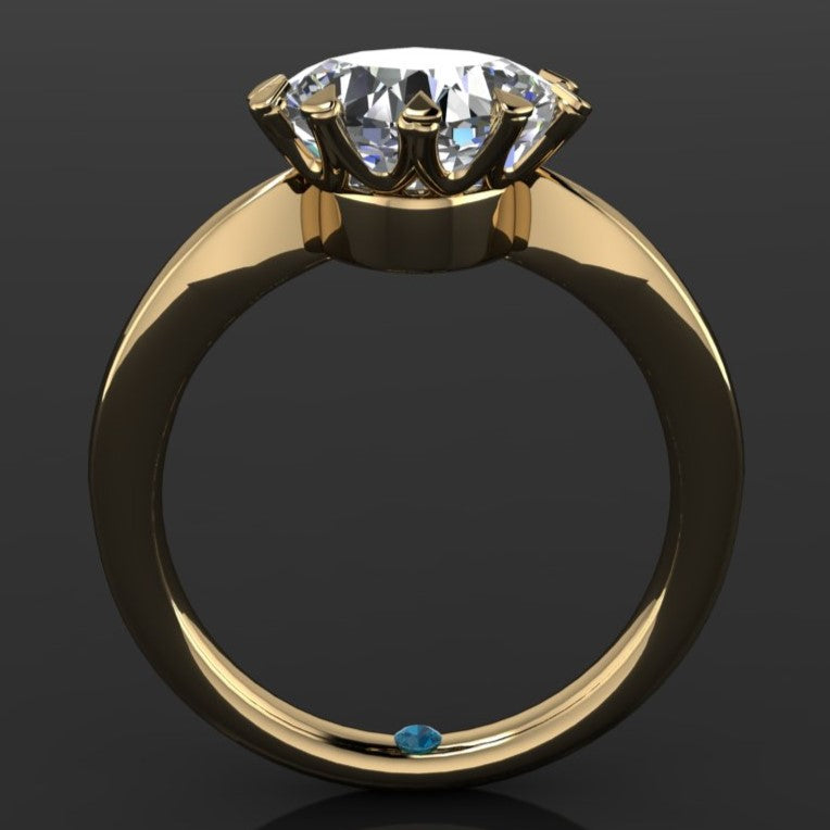 The Lady Danbury ring featuring a 2.5 carat old mine cut cushion moissanite center. A solitaire ring with 10 prongs, profile view