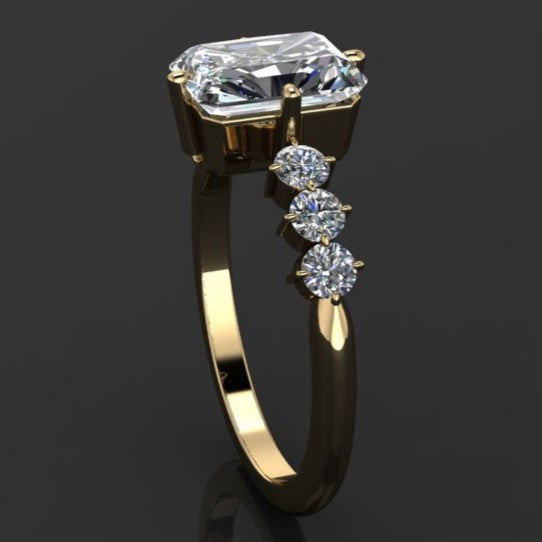 2 carat radiant moissanite center with six nicely sized side stone with prongs set north, south, east, and west - side view