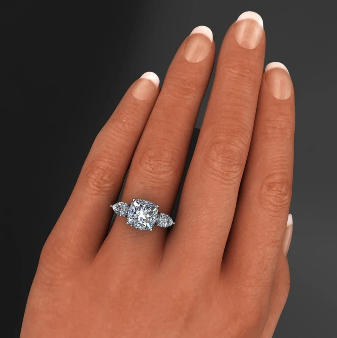 cushion moissanite 3 stone engagement ring on hand model - erica - J Hollywood Designs